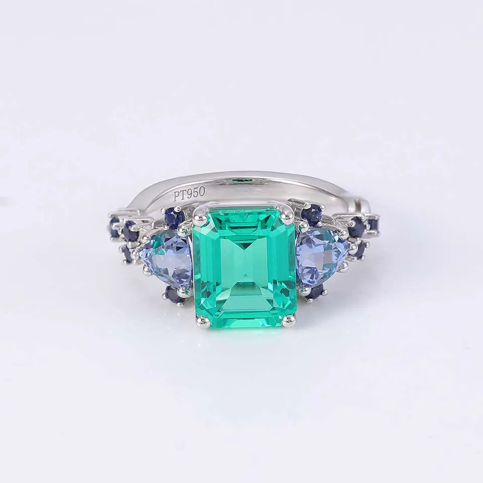 10K-18K , Emerald Ring With Trillion Sapphires And Dark-Colored Rounds